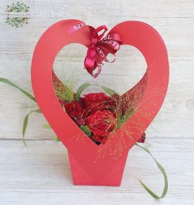 Red roses in heart shaped bag