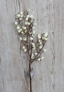 Artificial branch with white berries