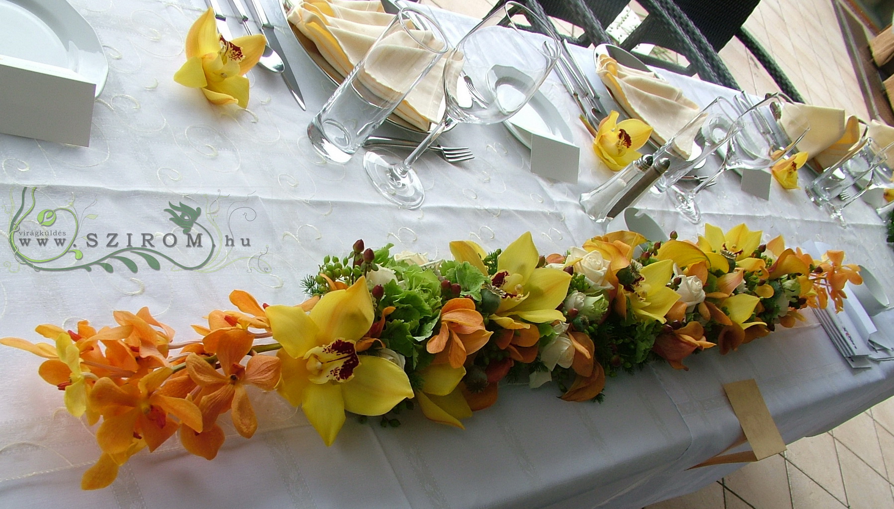 flower delivery Budapest - Main table centerpiece with orange orchids, Robinson Restaurant  Budapest, wedding