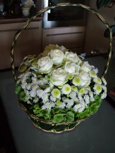 white roses basket with green and white flowers