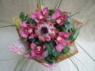 protea with orchids and eucaliptus