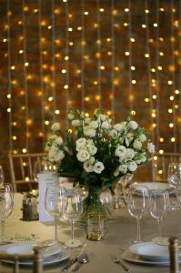 Main table centerpiece Malom Bistro (lisianthus, white), wedding