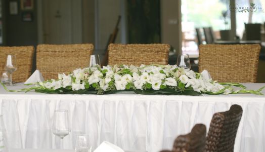 Main table centerpiece Hemingway restaurant (orchid, gladiolus, cala, button chrysanthemum, white, green), wedding