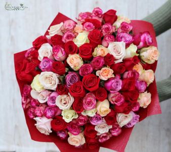 90 stems of red, pink, purple, white roses in a round bouquet