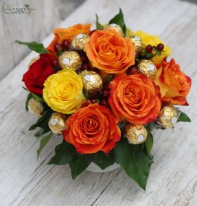 Ceramic pot with warm color roses, and chocolate balls (9 stems)