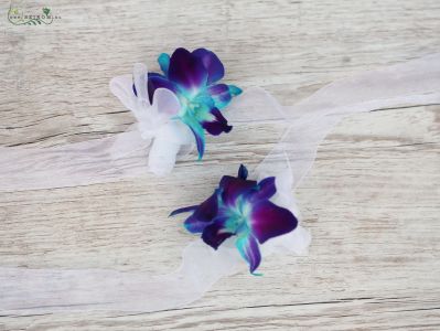 wrist corsage made of blue dendrobium orchids