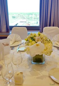 Wedding centerpiece in glass cube, Hilton Buda Castle (phalaenopsis orchid, lisianthus, alstomelia, white)