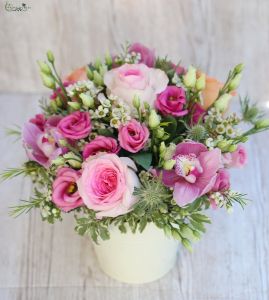 Pink composition in a pot with orchids, roses and lisianthus