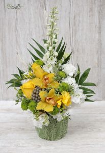 Composition with yellow orchids in leaf stuctured pot (13 stems)