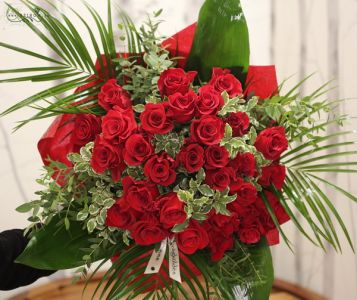 33 red roses with lots of green