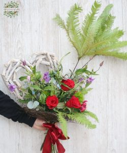 Red roses with meadow style flowers, umbrella fern and a big wooden heart