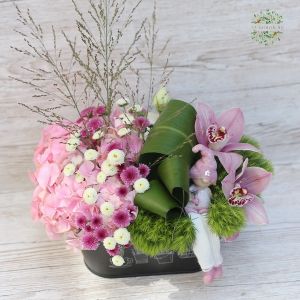 Metallic bowl with hydrangea and orchids, with hanging feet figure
