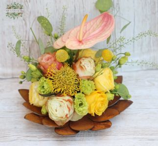 Lotus shaped metallic bowl with flower arrangement