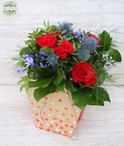 Small red rose bouquet with agapanthus, eryngium (9 stems) in aquapack paperbag