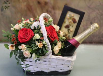 Gift basket with flowers, chocolates and champagne