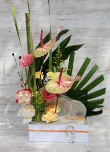Summer tropical sandy beach flower box with flamingo flower, comb shell