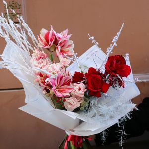 winter red moon shaped bouquet with amaryllis and red roses