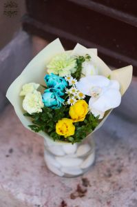 Small bouquet with tulips, chamomiles with vase