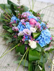 Main table centerpiece with hydrangea (blue, purple), wedding