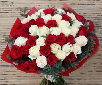 50 red and white roses in a round bouquet