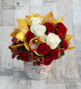 Arrangement in elegant pot made of orchids, red and white roses (16 stems + berries)