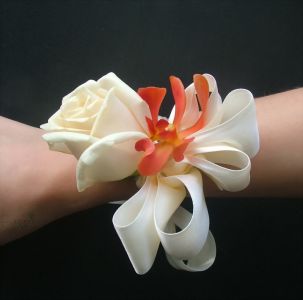 wrist corsage made of rose and orchid (cream, orange)