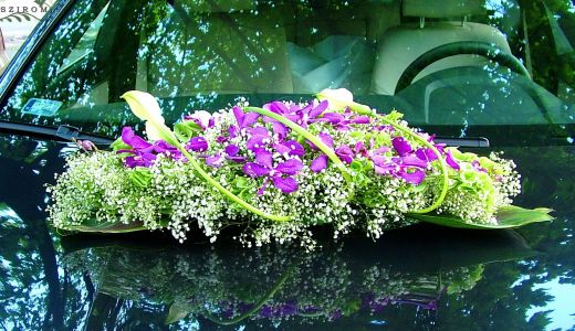 oval car flower arrangement with Dendrobium orchids, baby's breathe and calas (white, pink)