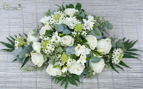 oval car flower arrangement with roses, ornithogalums, freesias