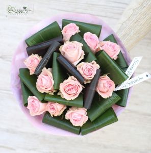 12 pink roses with aspidistra leaves