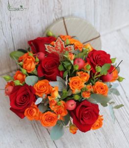 Box with red roses, spray roses, berries