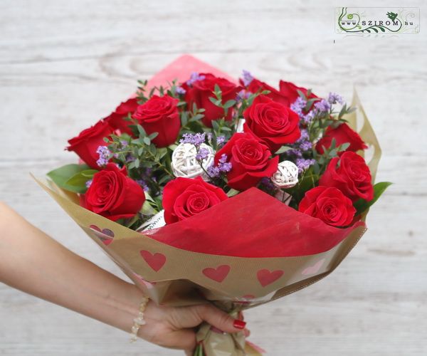 15 red roses in bouquet paper with hearts with small flowers