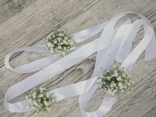 wrist corsage made of white baby's breathe