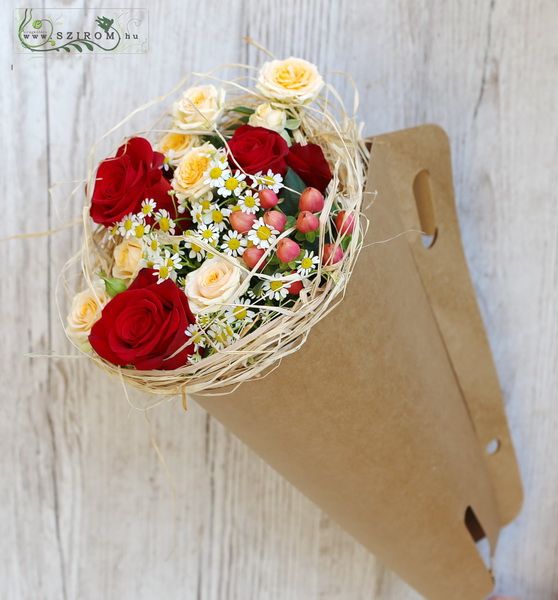 Craftpaper cone with summer bouquet of roses and camomiles
