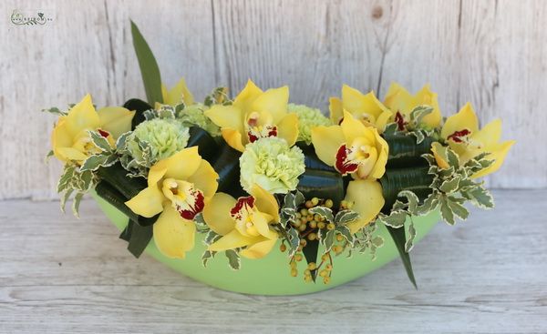 Boat shaped flowerbowl with 10 yellow orchids 