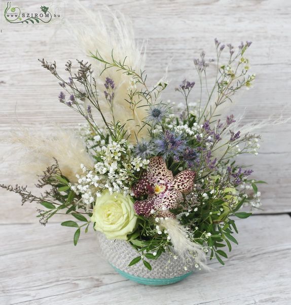 Flower arrangement with small flowers, roses, orchid, pampas grass