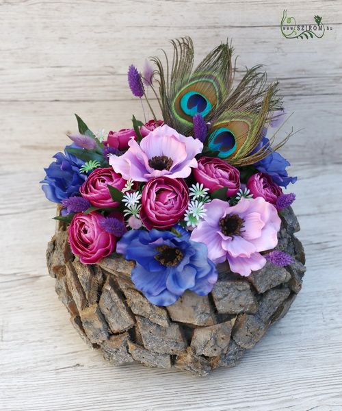 Rustic wooden ball with silk flowers and peacoc feathers