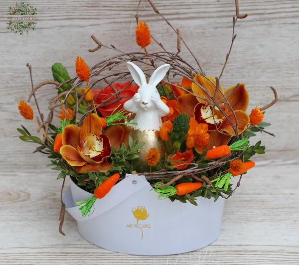 Bunny in box with orange flowers, orchids