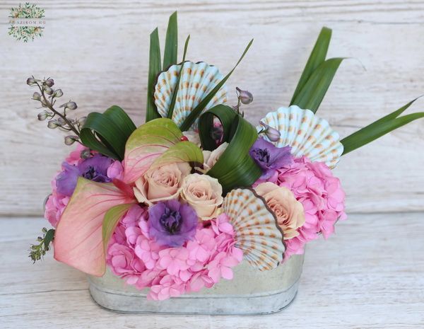 Flowerbowl with seashells with hydrangea and anthurium