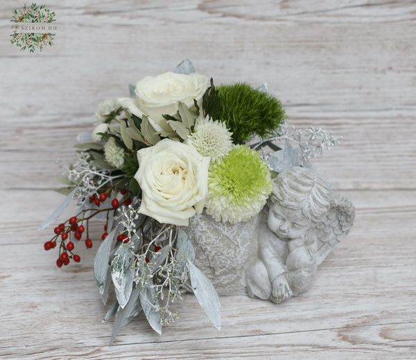 Angel pot with white flowers, red berries