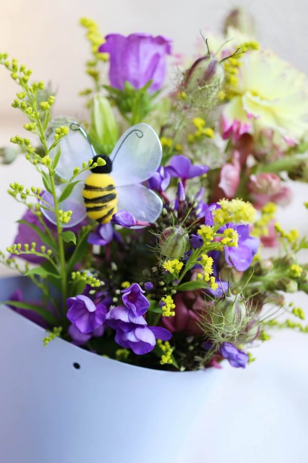 Meadow type flowers in paper cone, with bee (13 stems)