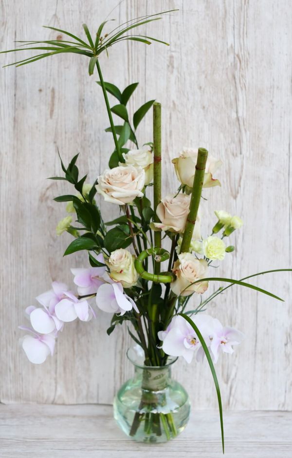 Oriental rose bouquet with orchid stem, vase