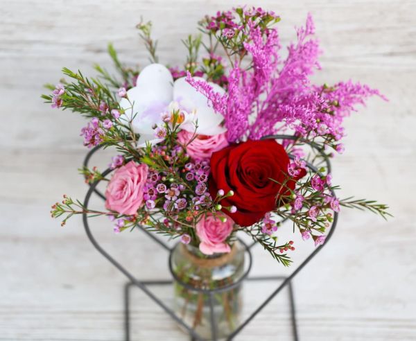 Heart shaped metal vase with rose, orchid, small flowers