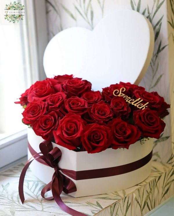 heart box with 19 red roses and the inscription I love you