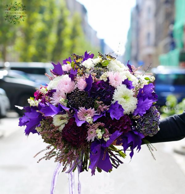 Giant purple autumn bouquet with hydrangeas, chrysants, berries