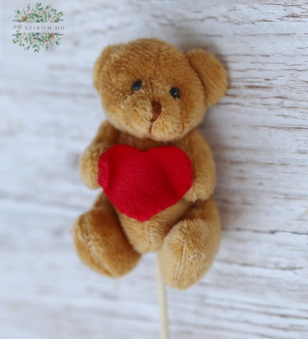 sticked brown teddybear with a red heart