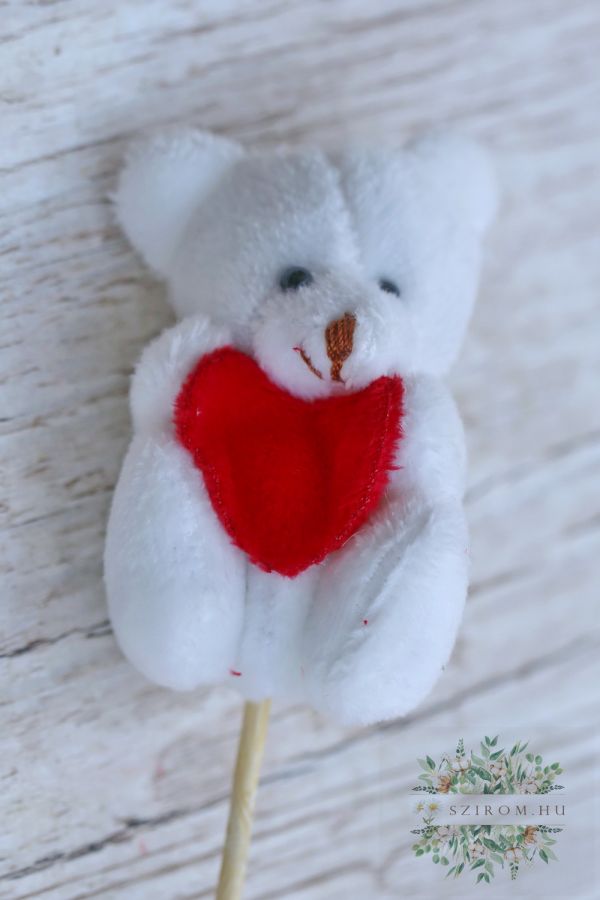 weisser Teddybär mit red heart an einer Stiele