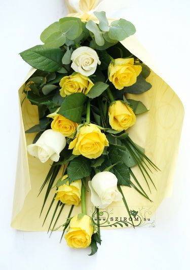 10 yellow and white roses in a tall bouquet