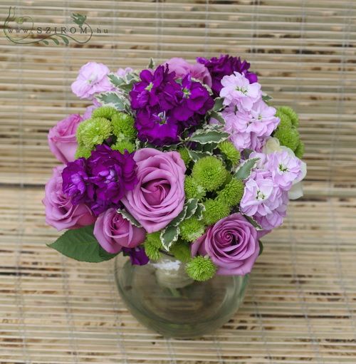Purple and green flowers with roses in a glass ball (18 stems)