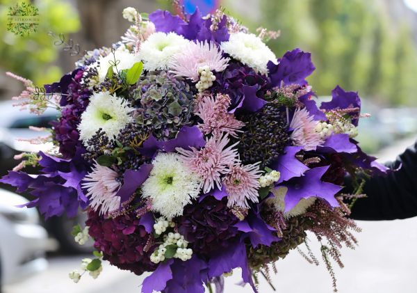 Giant purple autumn bouquet with hydrangeas, chrysants, berries