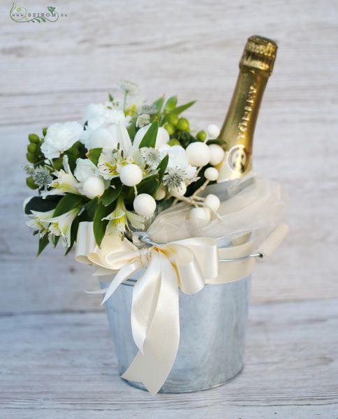 Champagne with white flowers in tin pot 